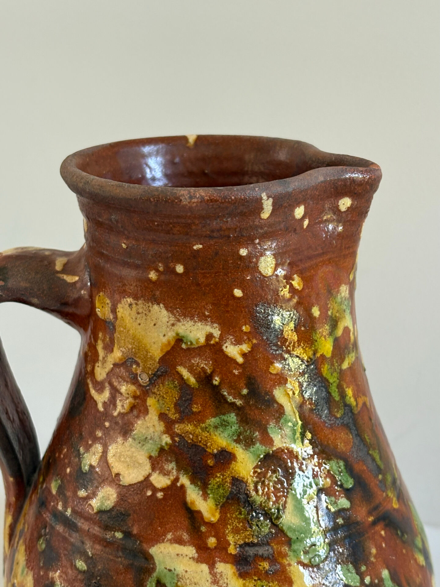 Studio ceramic pitcher with sprayed glazes – circa 1960-70