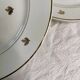 11 plates in antique earthenware decorated with golden leaves and golden border