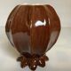 Brown ceramic corolla vase
