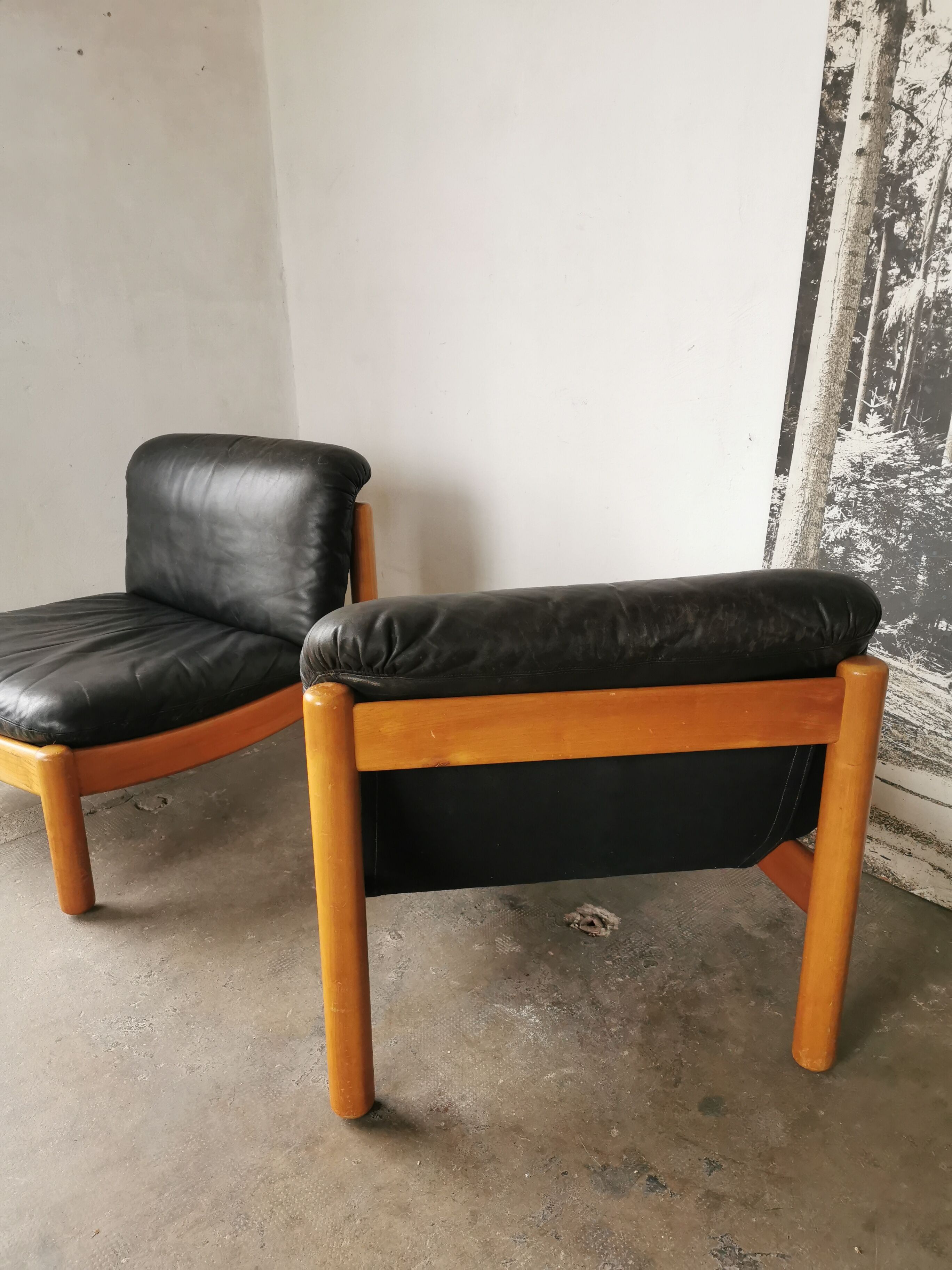 Pair of designer leather armchairs 80s