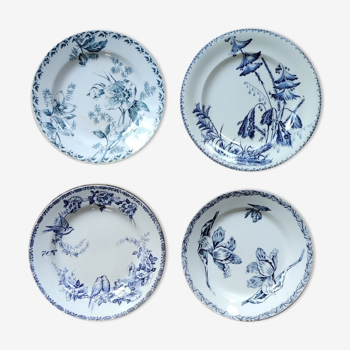 Lot de quatre assiettes plates en terre de fer