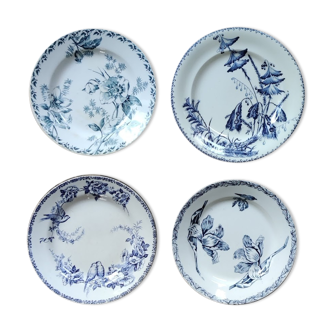 Lot de quatre assiettes plates en terre de fer