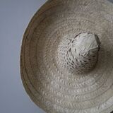 Hand-woven wicker straw hat, ethnic decoration object, sombrero, handmade