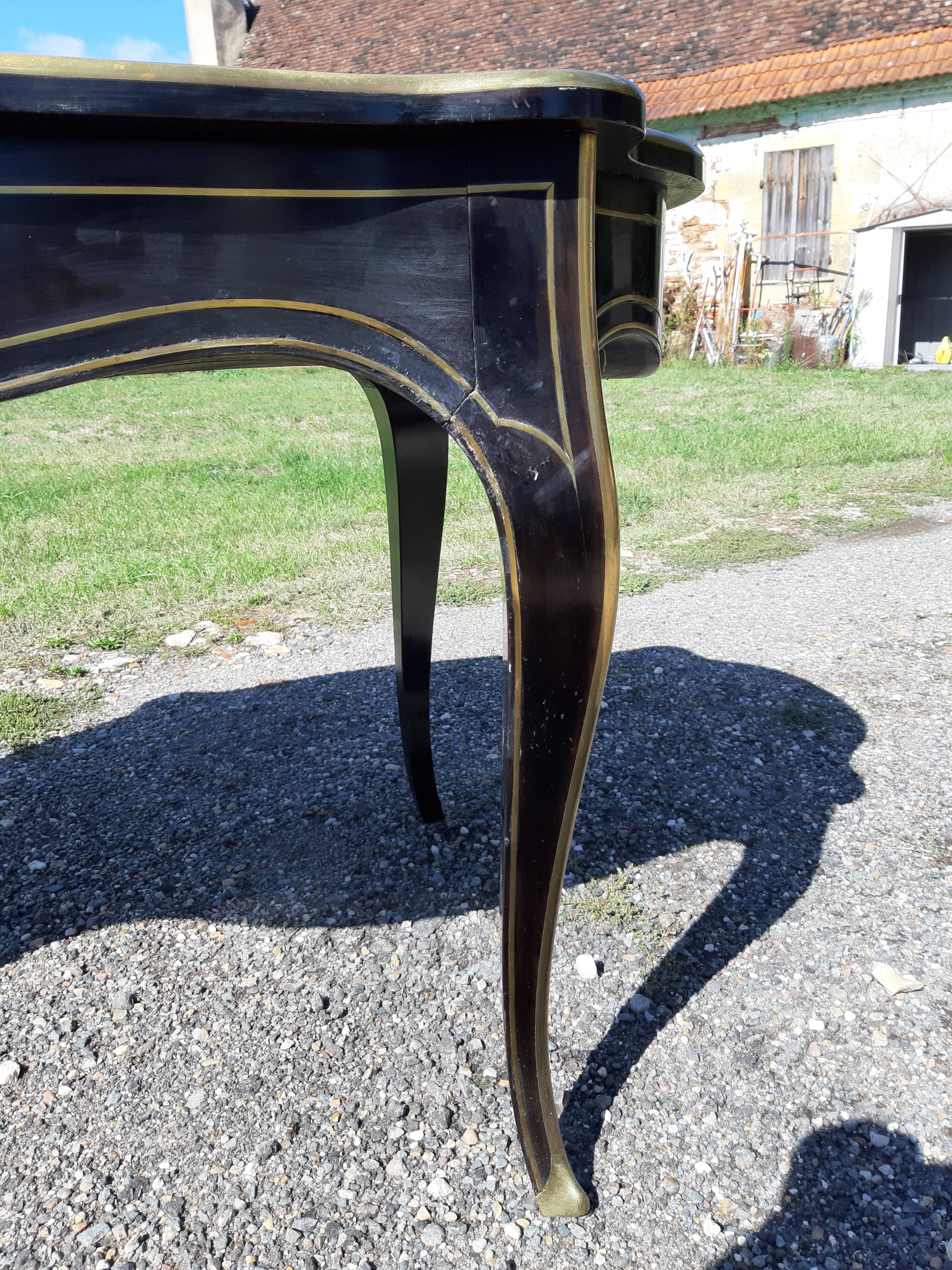 Napoleon III black lacquered wood and brass table