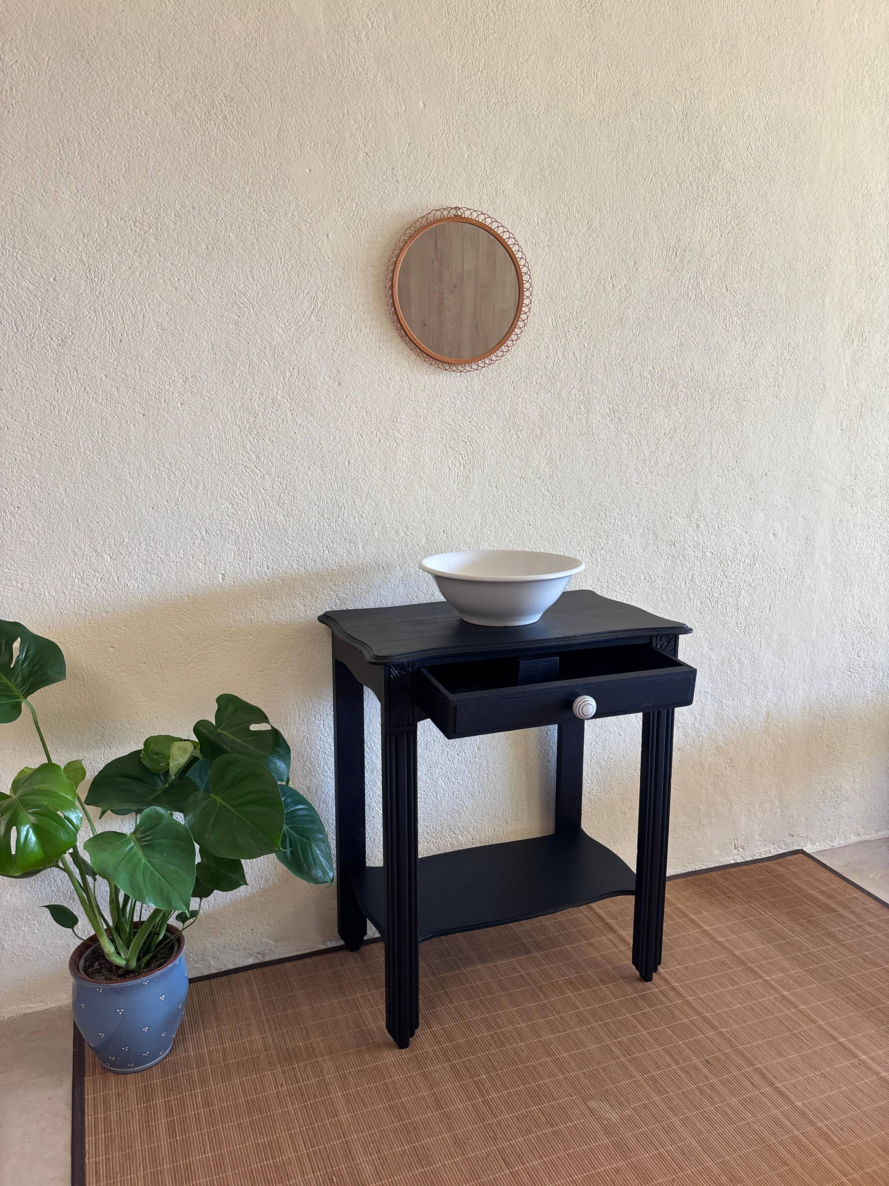 Small Art Deco console reinterpreted – matte black wood with drawer