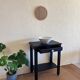 Small Art Deco console reinterpreted – matte black wood with drawer