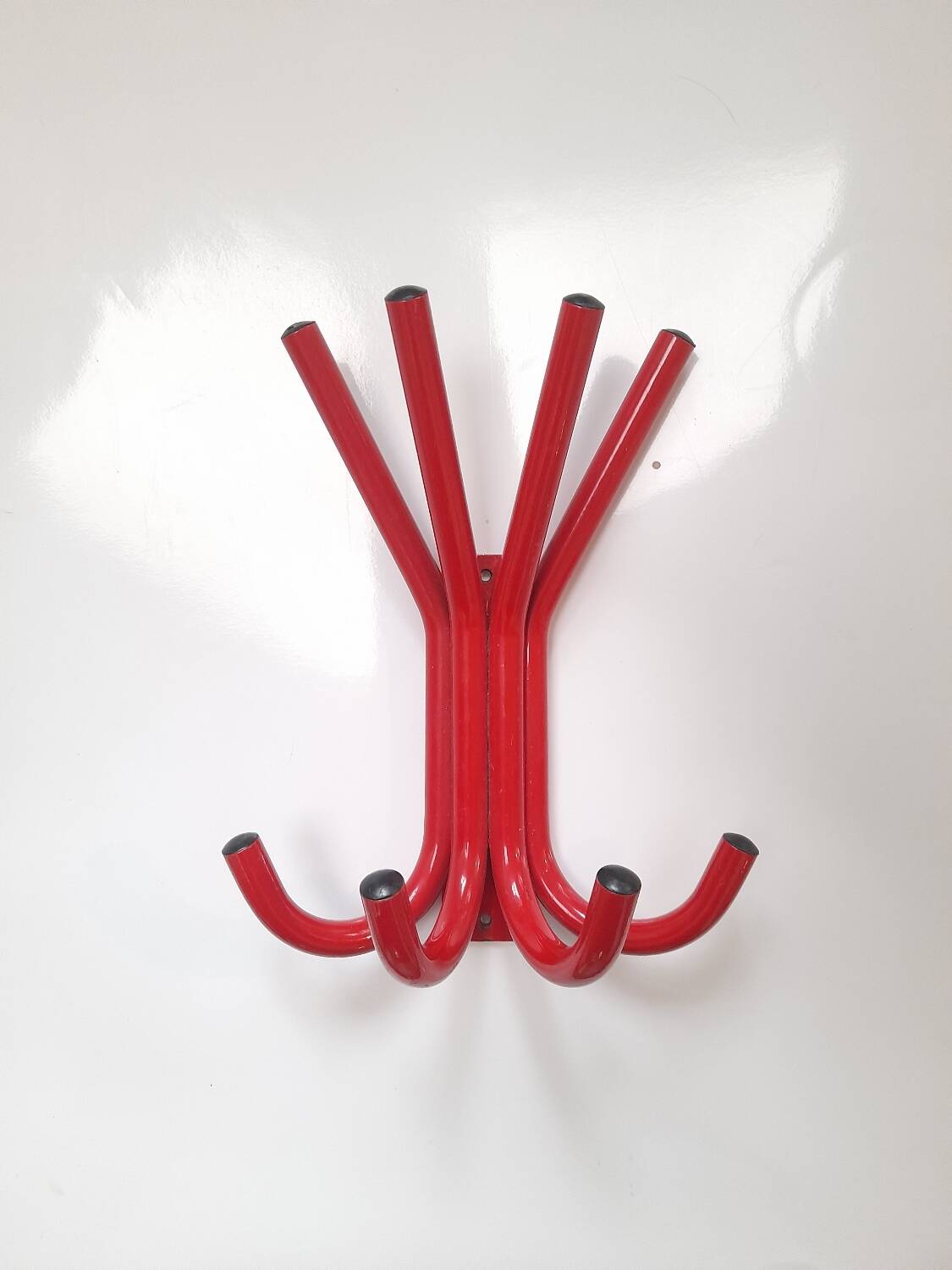 Red lacquered metal coat rack from the 80s