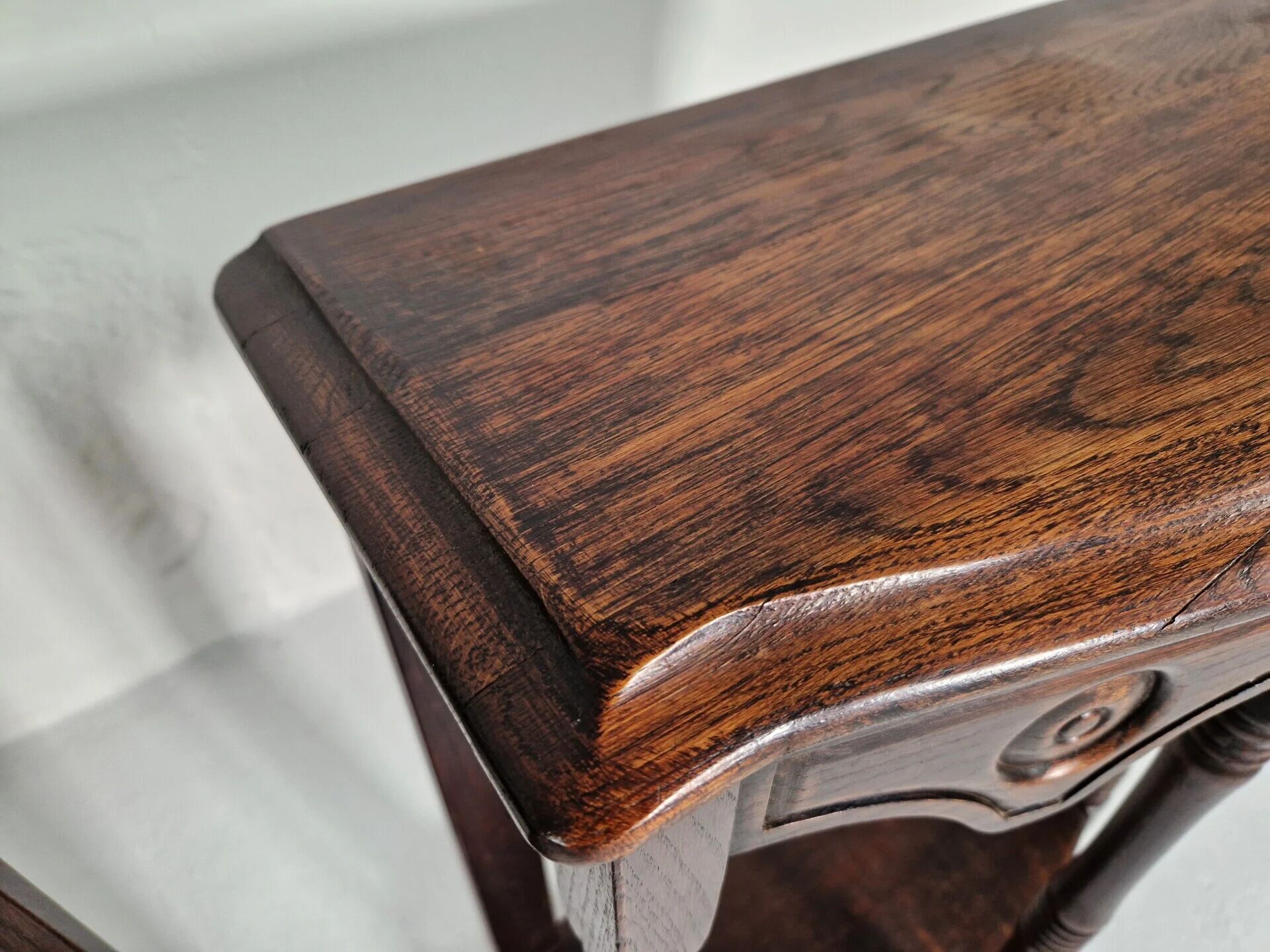 Pair of English 1920s carved oak sidetables