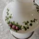 White opaline vase decorated with roses