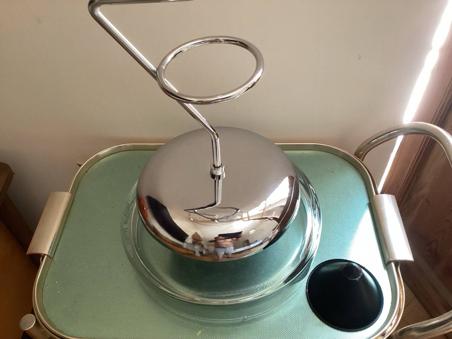 Designer umbrella stand in chrome metal and wood.