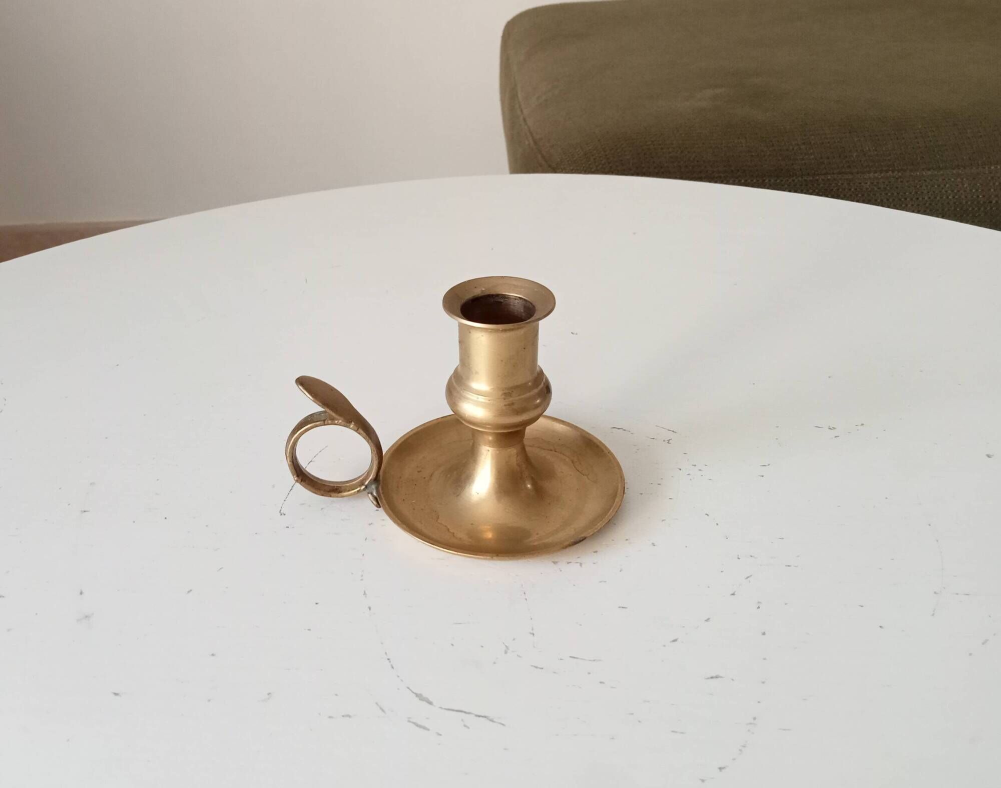 Antique hand candlestick in solid gilded brass.