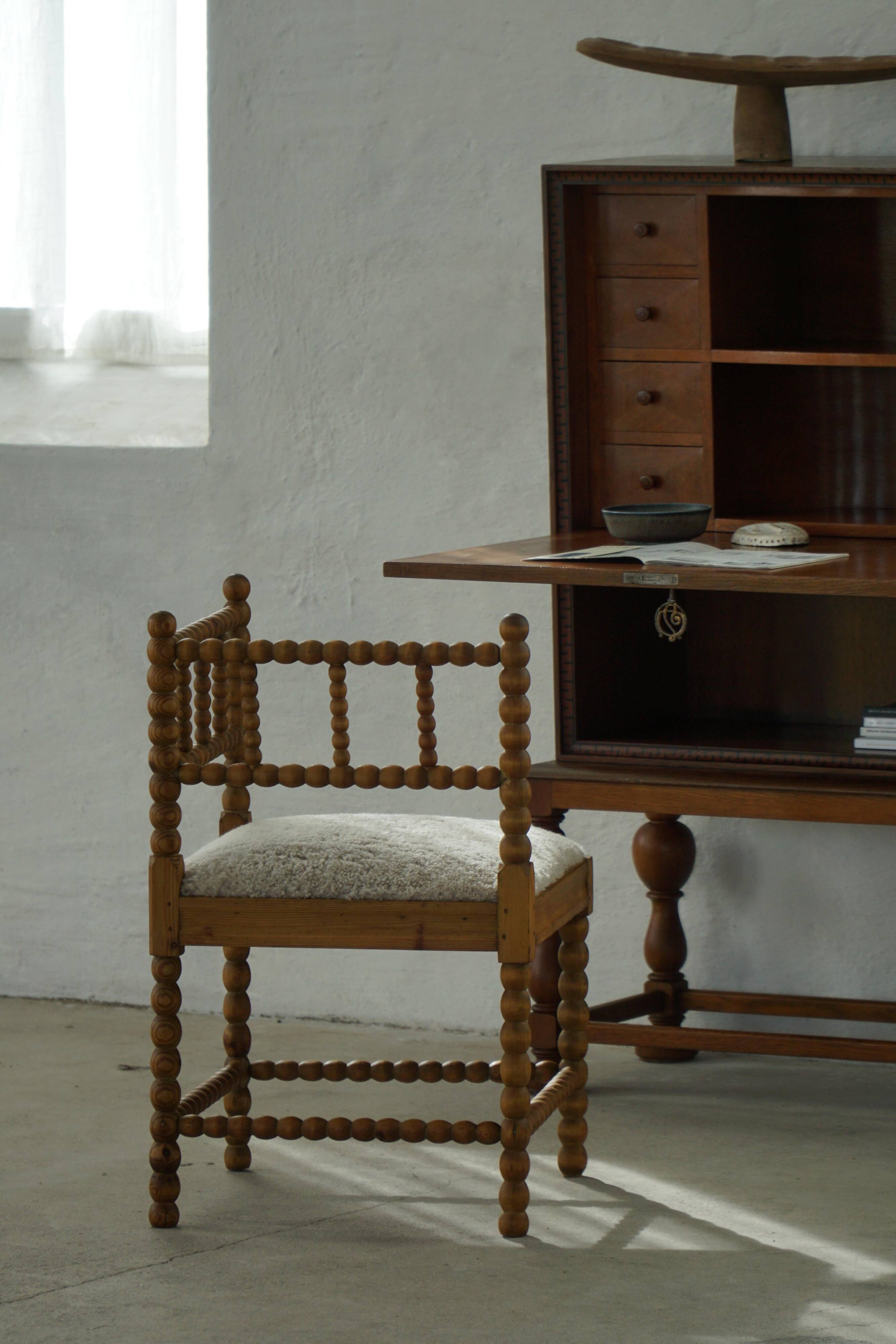 Antique French corner chair handcrafted with lamb's wool, early 20th century.