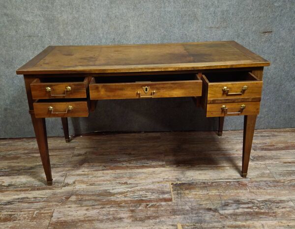 Bureau plat époque directoire en noyer, travail XIXᵉ siècle