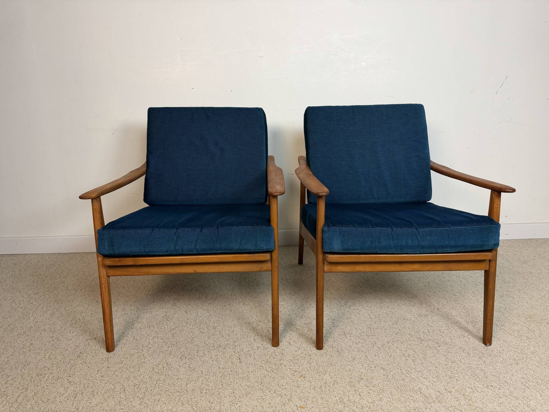 a pair of Scandinavian armchairs in teak from the 1960s