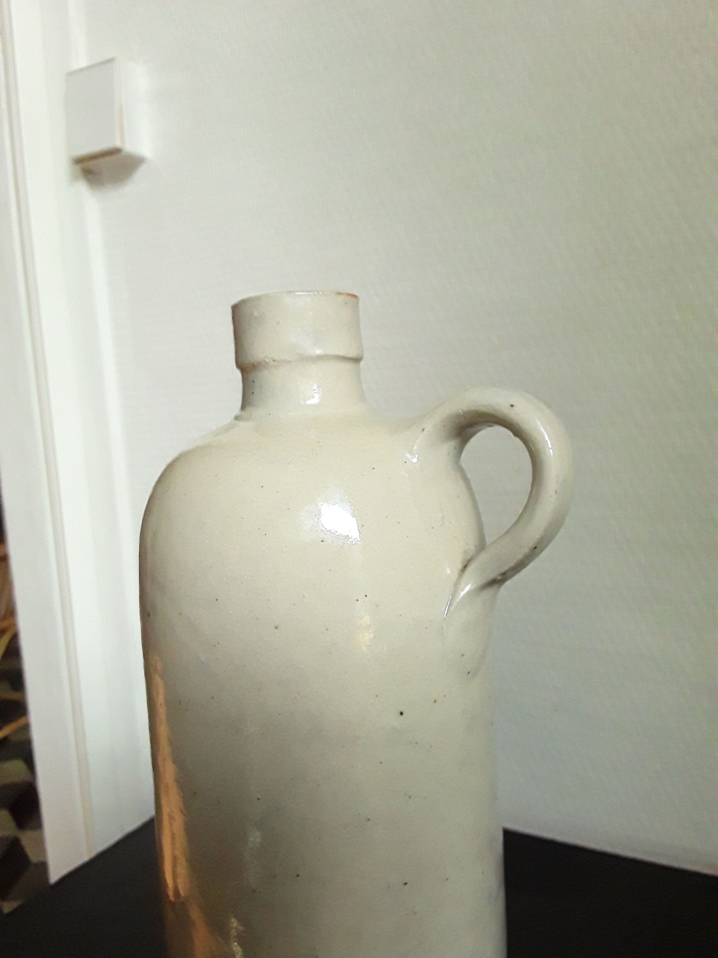 Vintage glazed stoneware bottle with handle