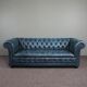 Chesterfield sofa buttoned in blue cowhide, 2.5 seats