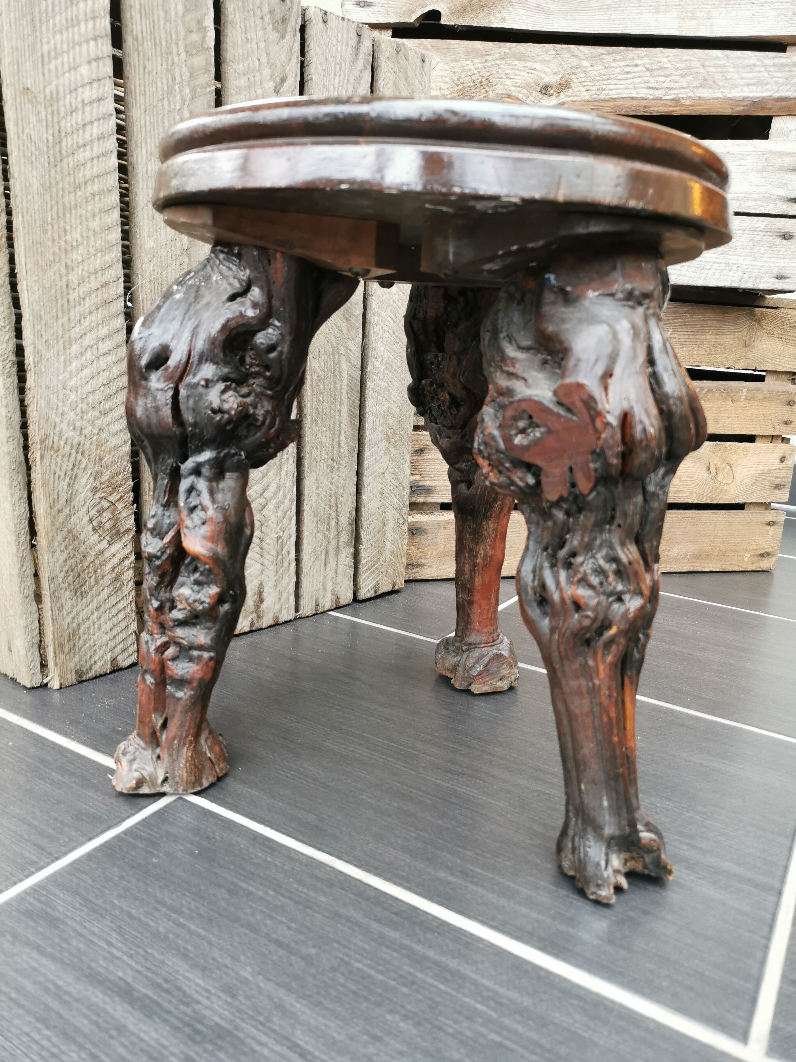 Artisan tripod stool in vines