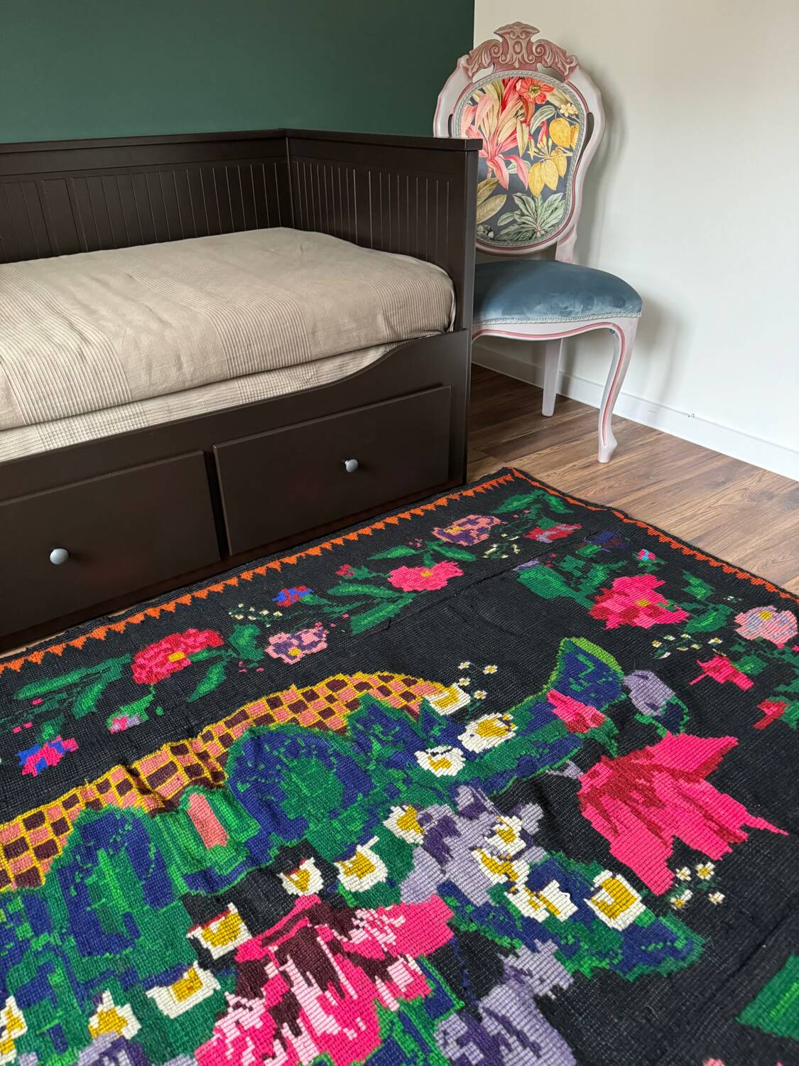 Romanian black wool carpet with a basket of colorful flowers