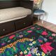 Romanian black wool carpet with a basket of colorful flowers
