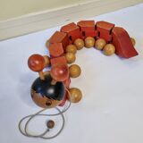 Vintage pulling toy, "centipede", 82 cm, made in Switzerland