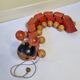 Vintage pulling toy, "centipede", 82 cm, made in Switzerland