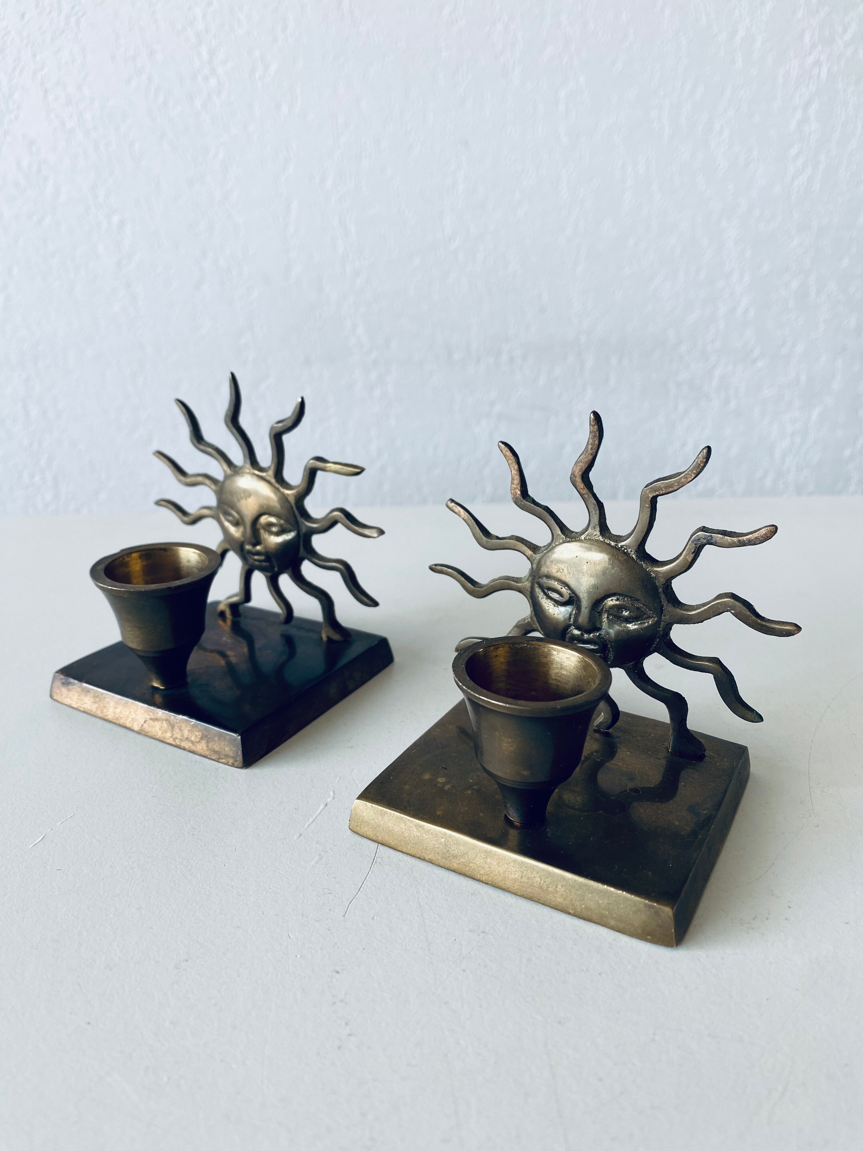 Pair of sun candle holders