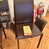 Many brown leather chairs "Roche Bobois"