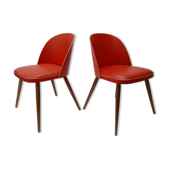 Pair of 50s chairs in red skai and wood