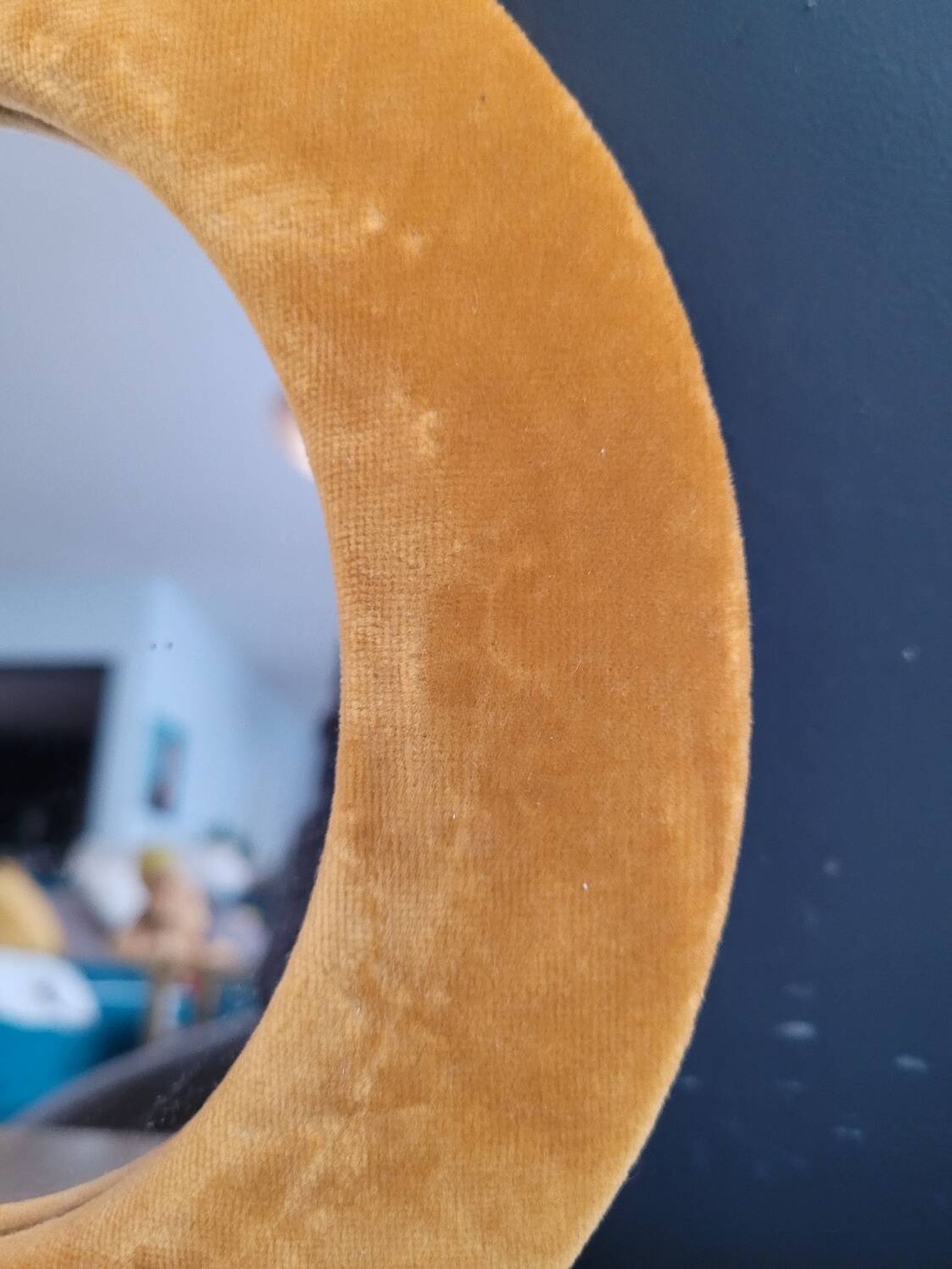 Vintage mirror with mustard velvet frame