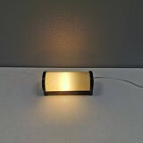 Old wall lamp, made of bakelite with a vanilla/egg colored glass shade.
