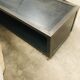 TV stand with natural steel accordion doors