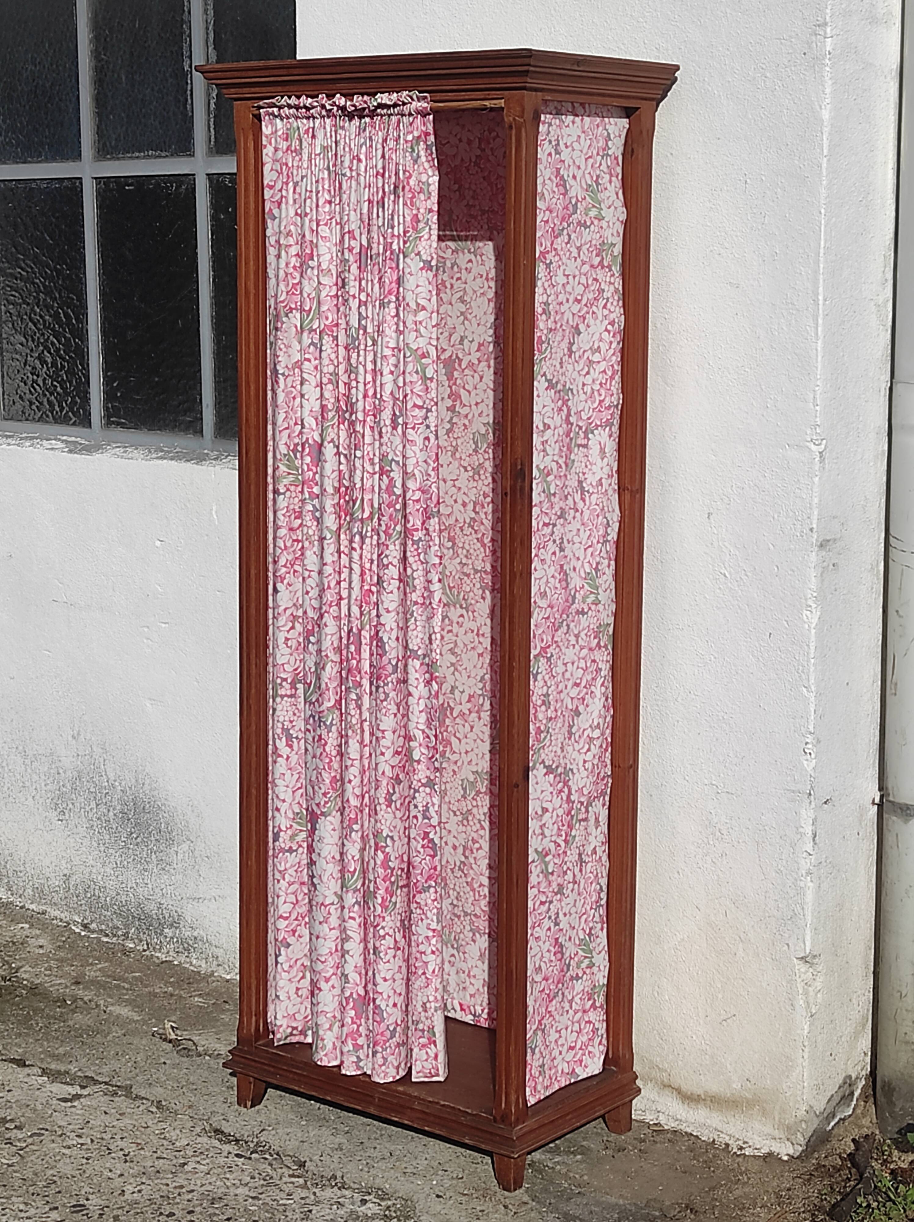 Old wardrobe in old wood and vintage fabric