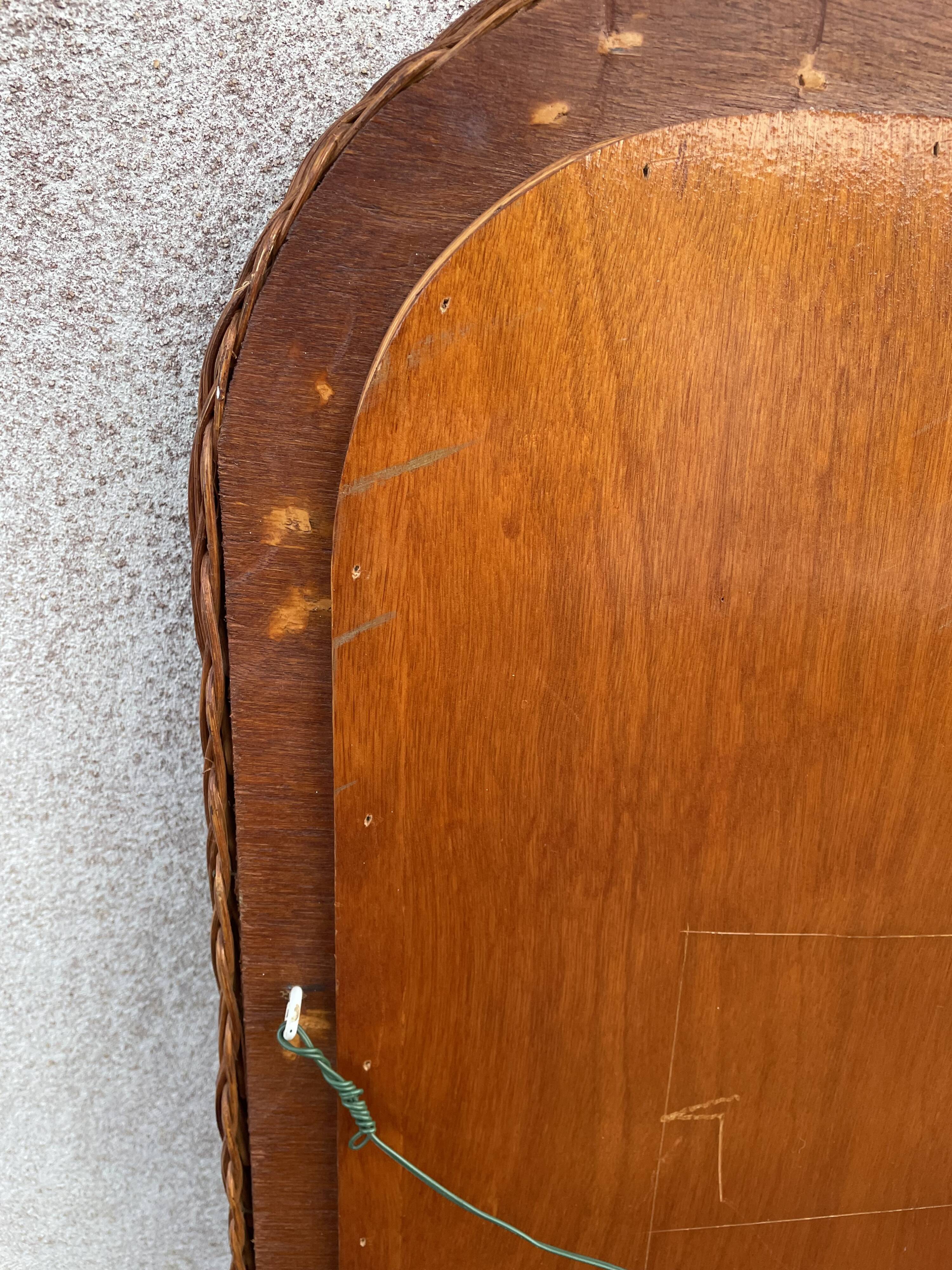 Curved rattan mirror 70s