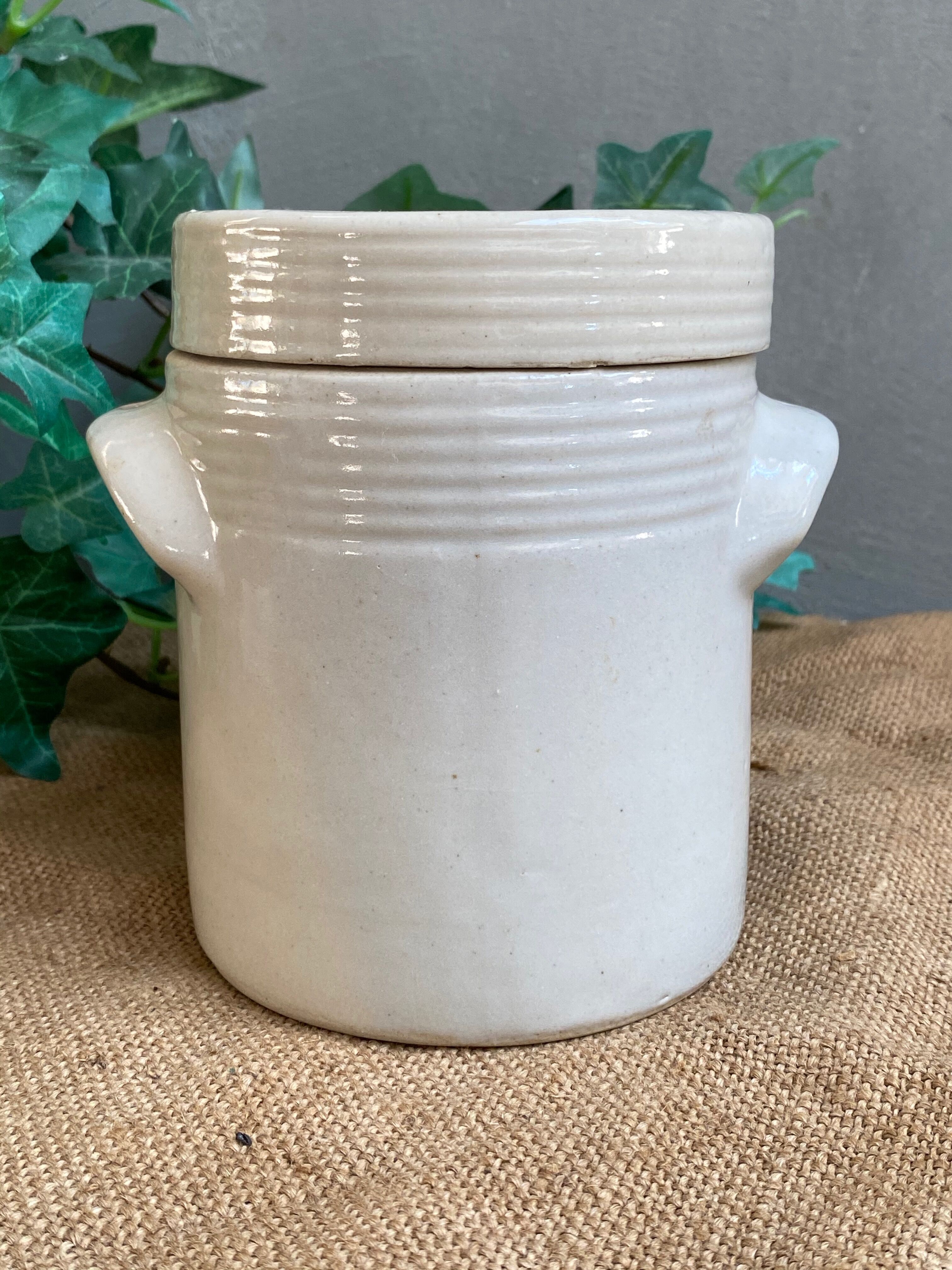 White pot in glazed earth