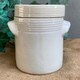 White pot in glazed earth