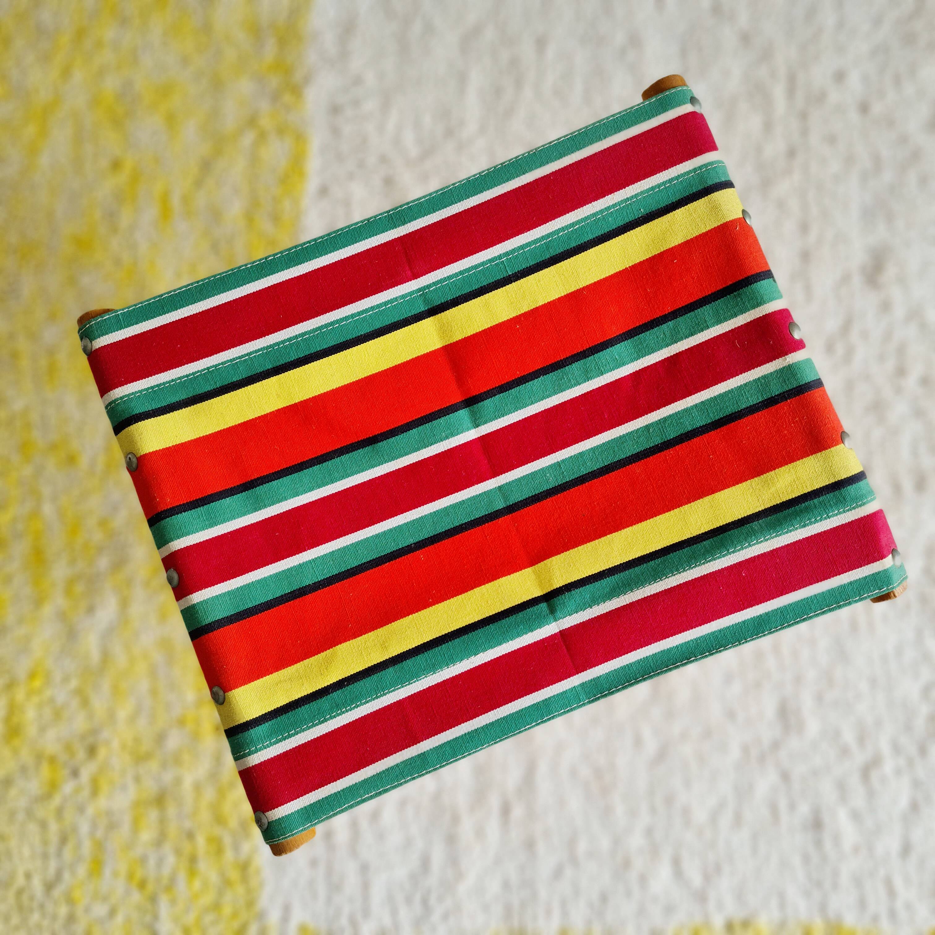 Folding fisherman stool with striped seat