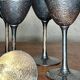 Set of six hammered metal goblets.