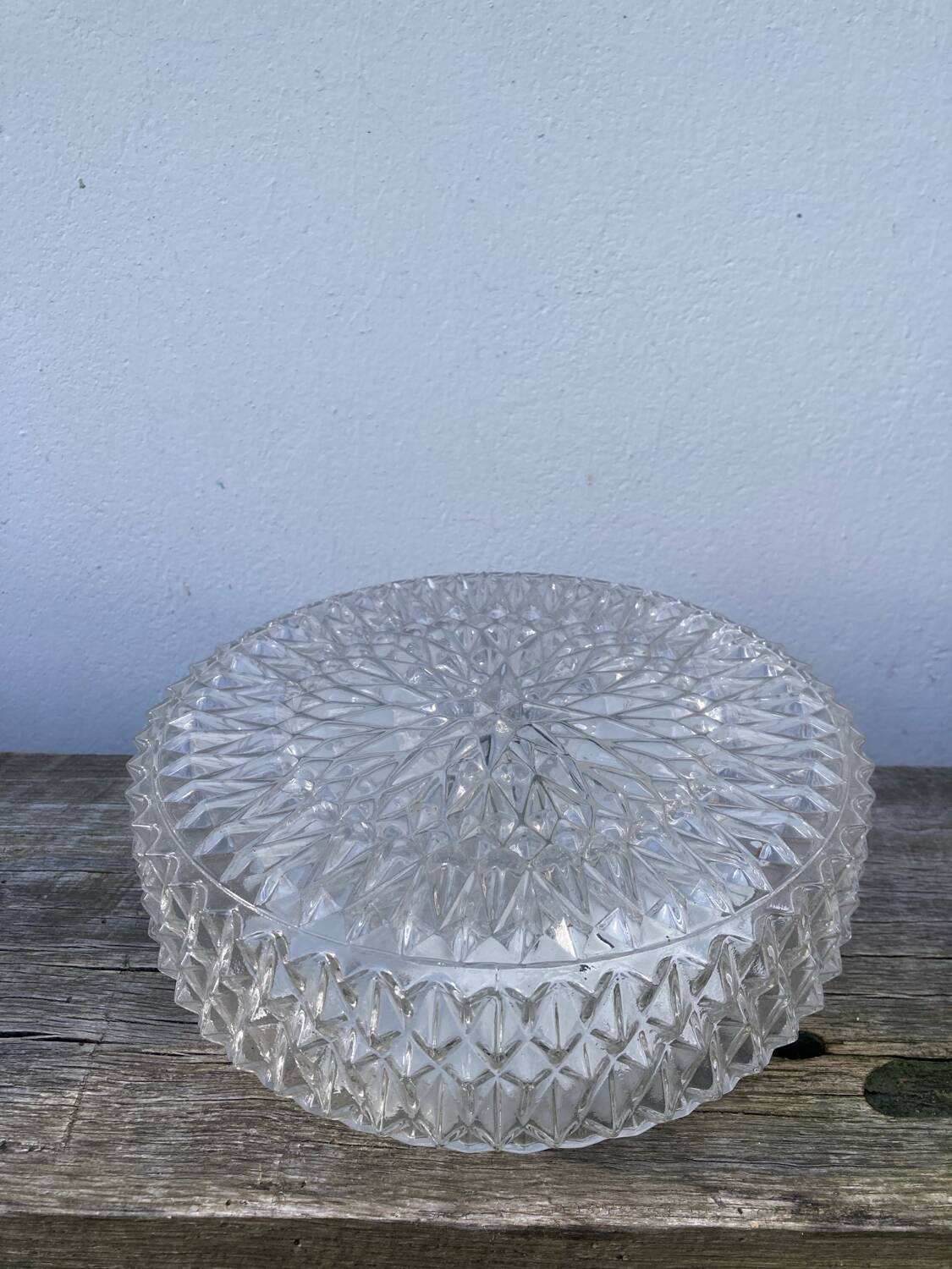 Pair of transparent round glass wall lights