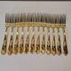 12 Table Forks in gold metal