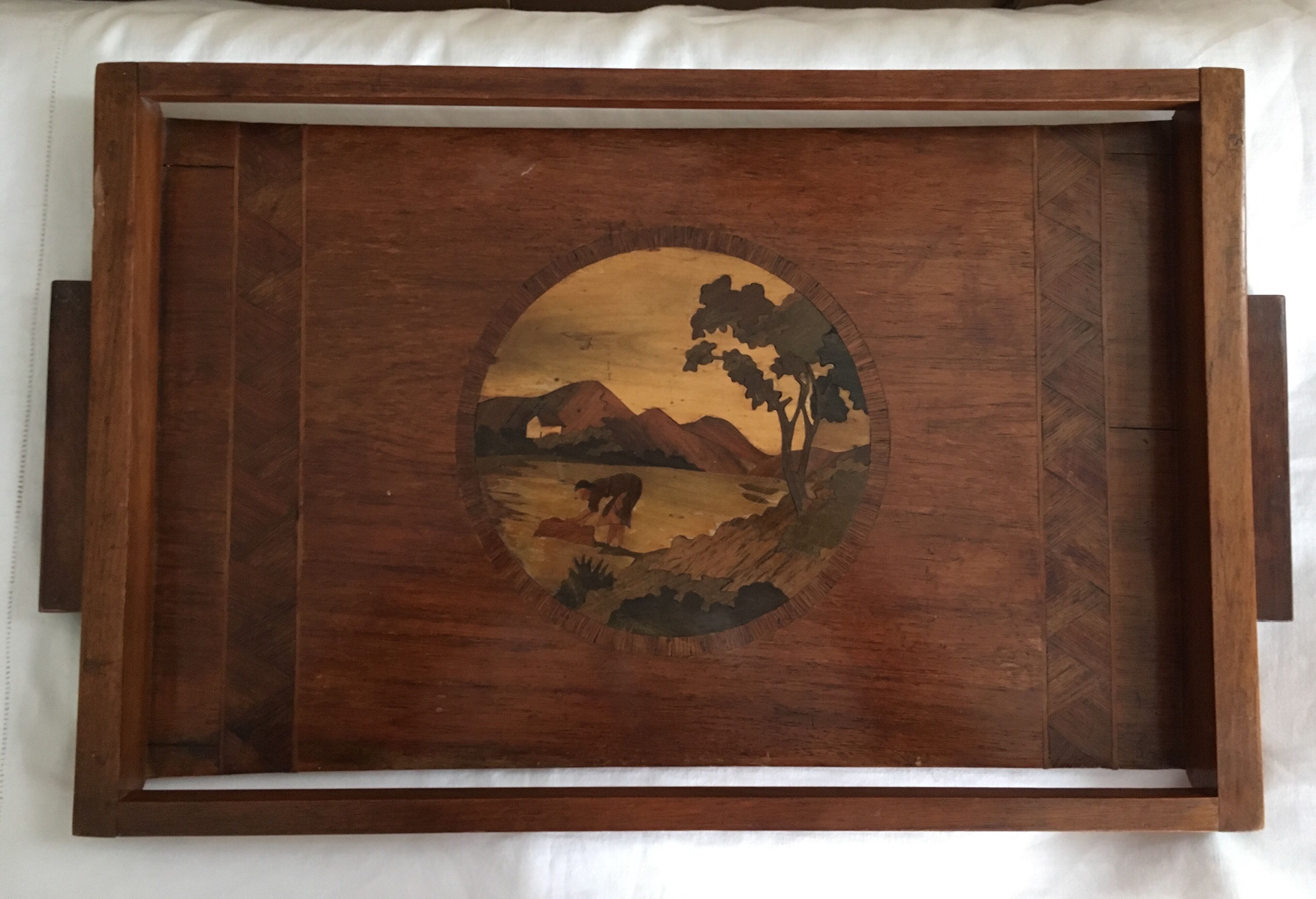 Old wooden serving tray with marquetry drawing