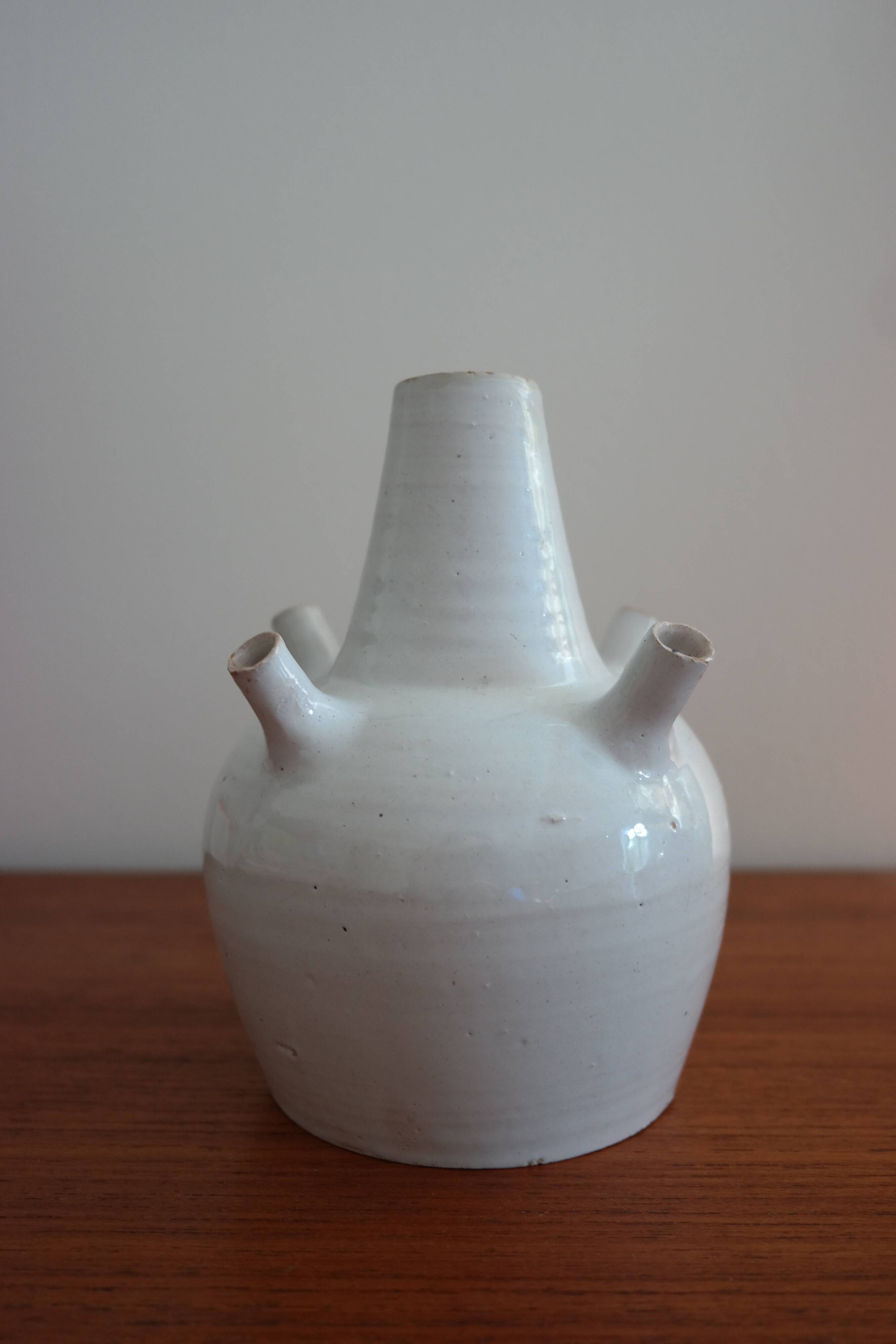 White enamelled earthenware flower vase signed HR