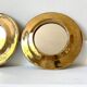 Round mirrors strapping in vintage gilded brass