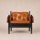 Paire de fauteuils lounge « safari » en cuir cognac et hêtre noir — c. 1970