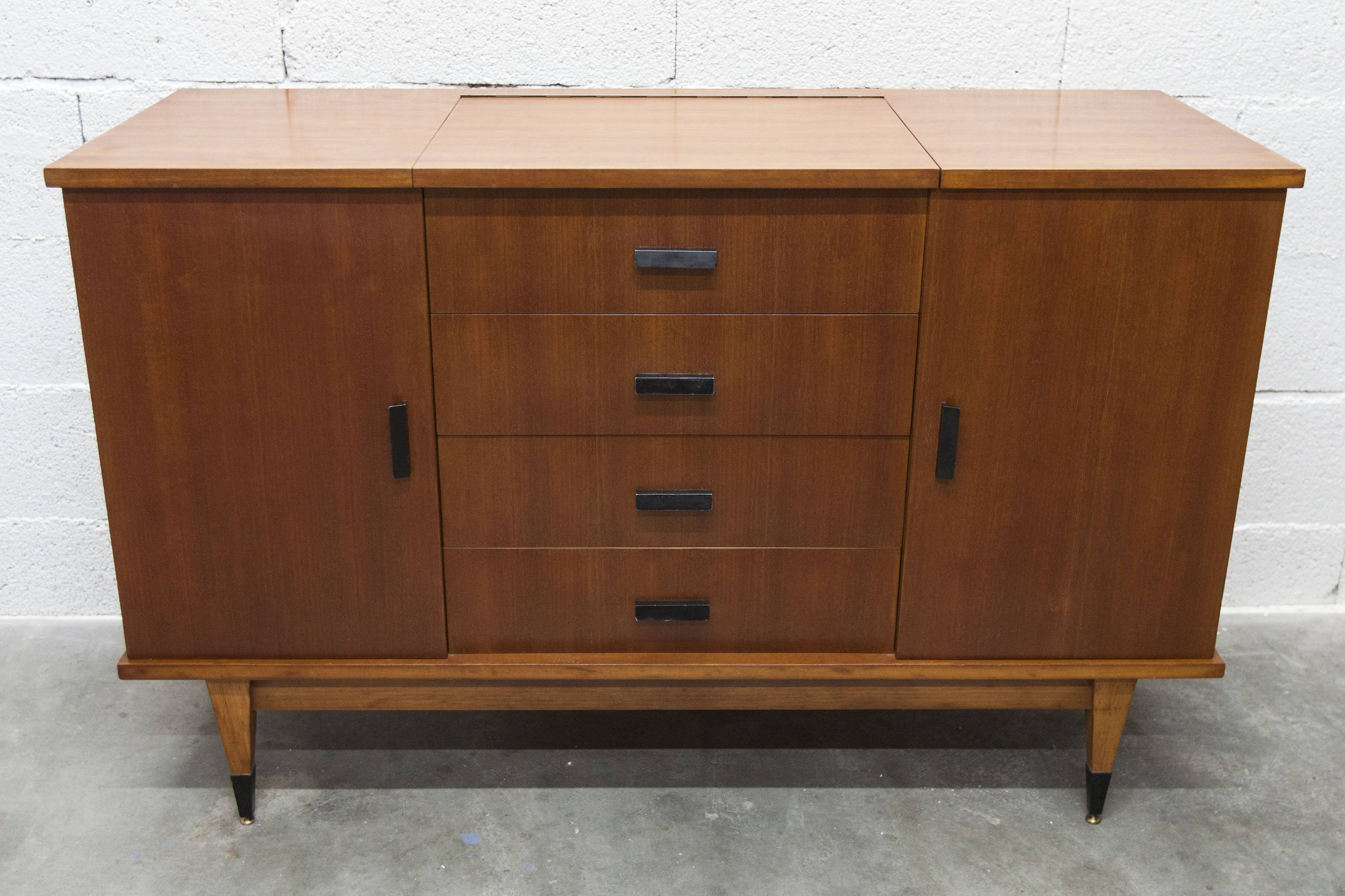 1960s teak sideboard with 4 drawers, 2 doors, and a mirror.