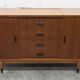 1960s teak sideboard with 4 drawers, 2 doors, and a mirror.