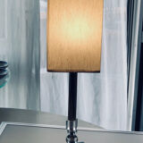 Silver floor lamp with a straight shade.