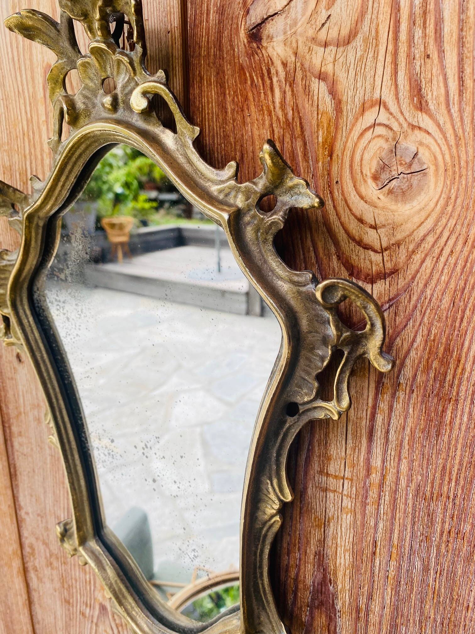 Magnificent antique baroque mirror in gilded bronze.
