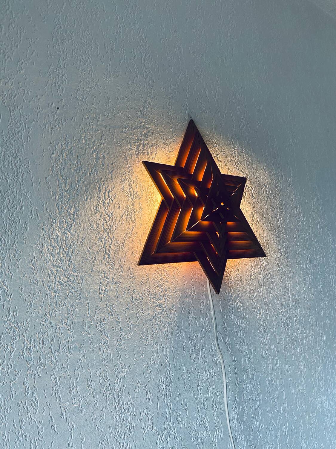 Luminous wooden wall star