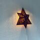 Luminous wooden wall star