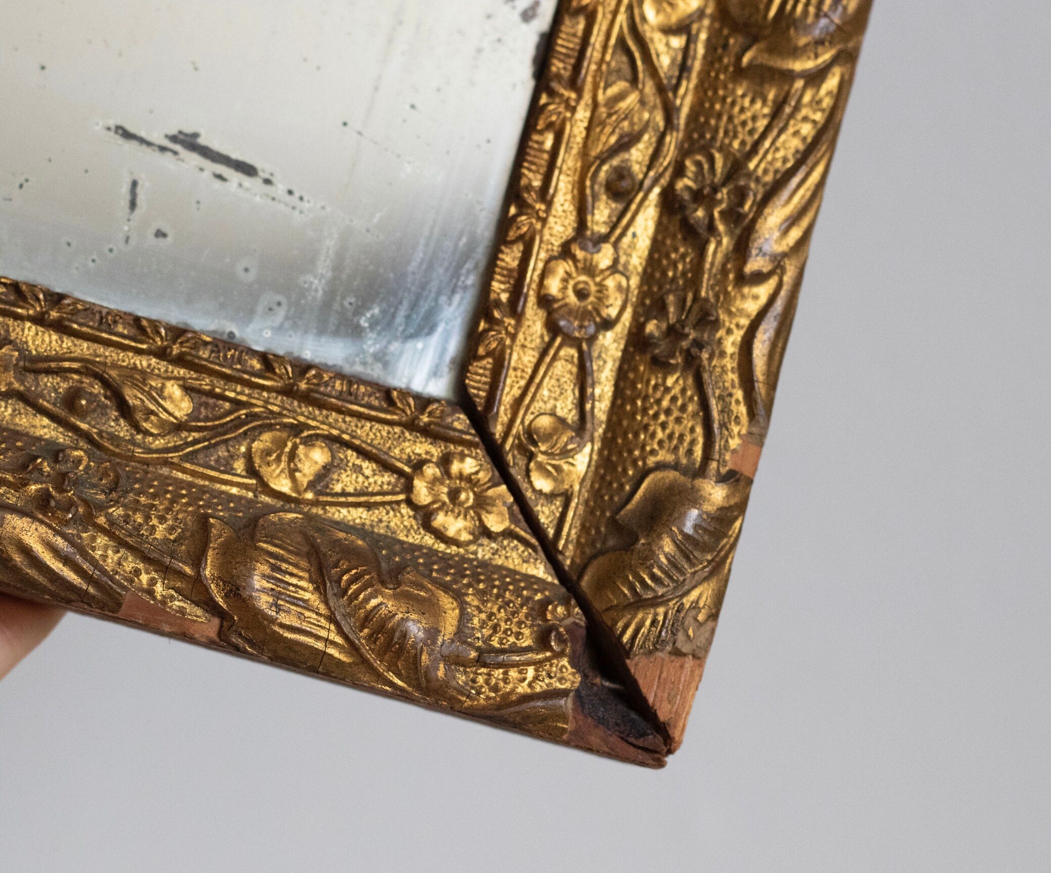 Antique mirror in gilded wood